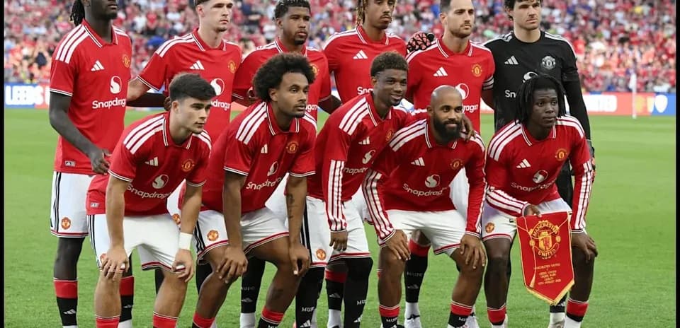 Manchester United team posing before a match
