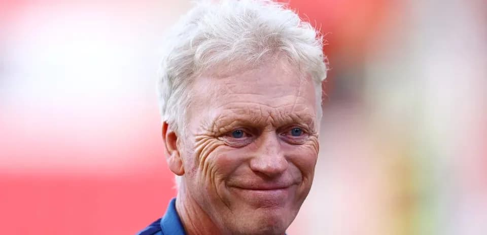 Football manager smiling before a match