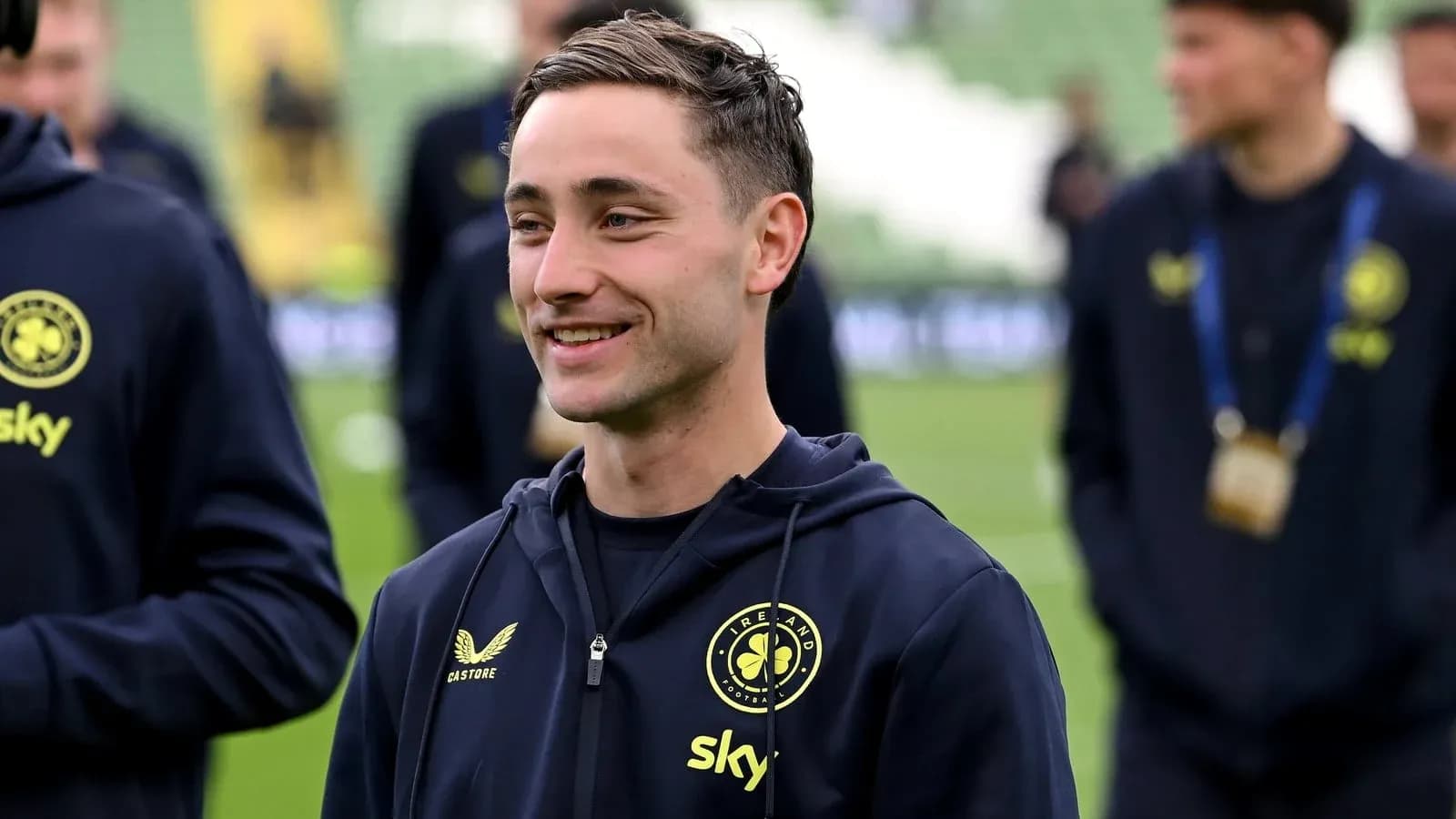 Player smiling during warm-up on the pitch