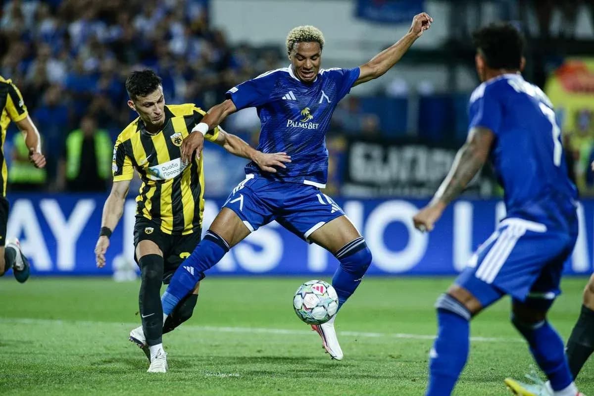Levski Sofia player dribbling against AEK Athens