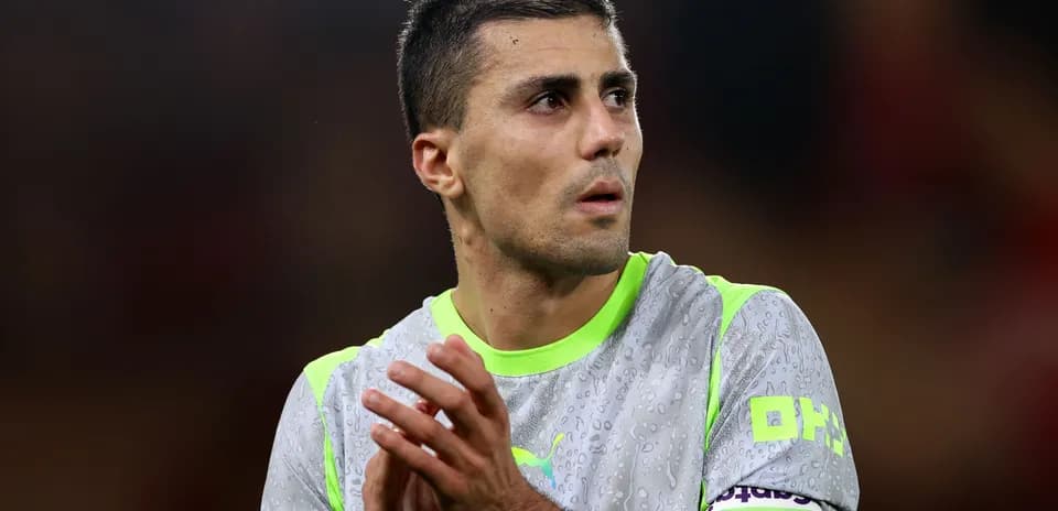 Player clapping in a wet training jersey