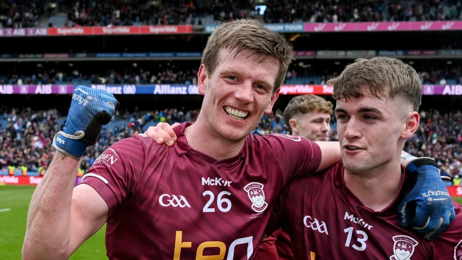 Two football players celebrating after a match Two football players celebrating after a match