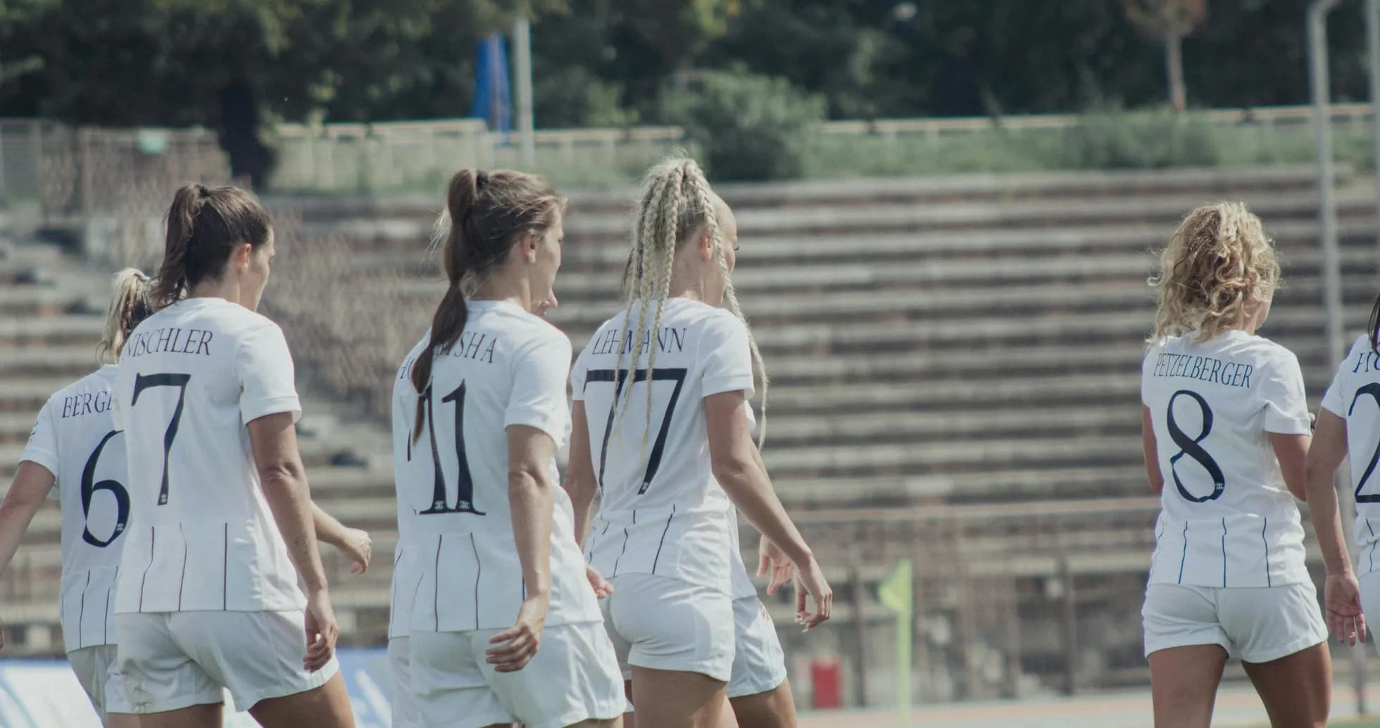 Players walking on the pitch before match