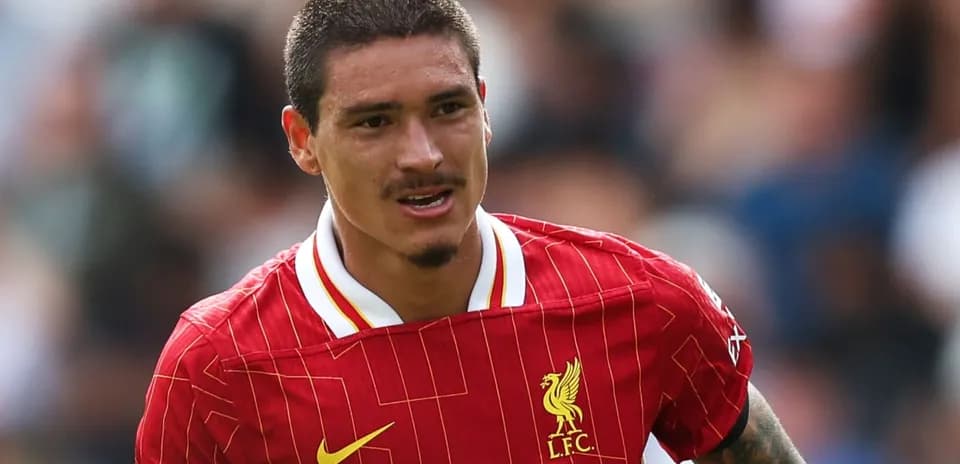 Player in red Liverpool kit running on field