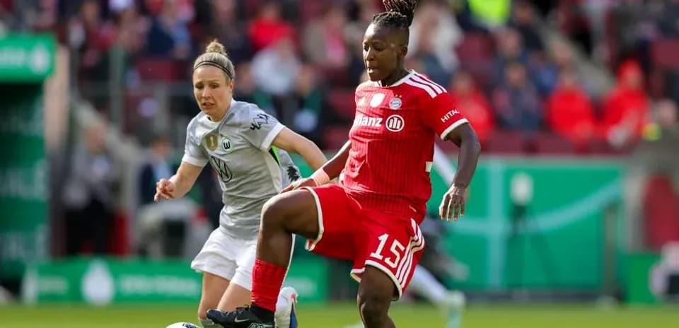 Two players contesting the ball during a match