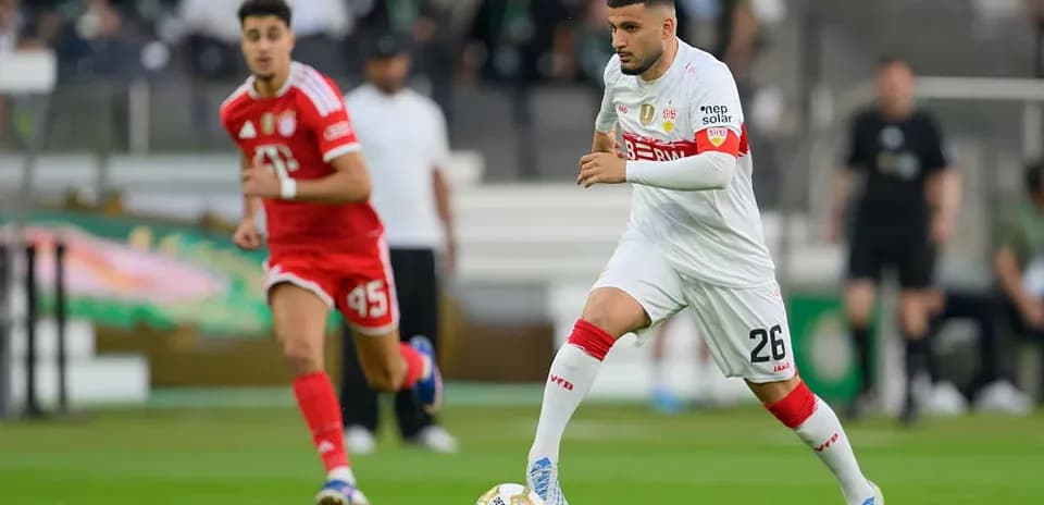 Player dribbling the ball during a football match
