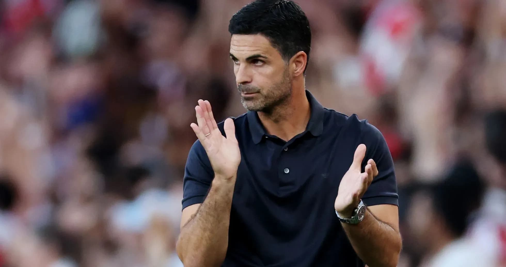 Manager clapping during a football match