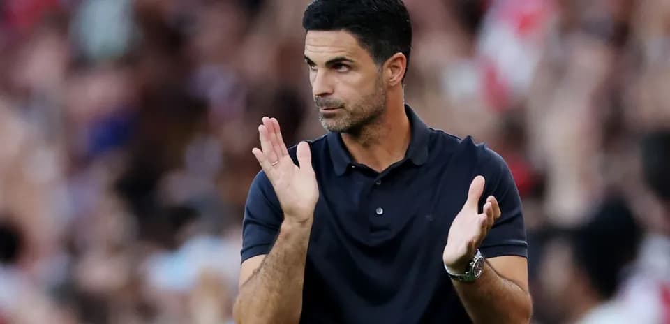 Manager clapping during a football match