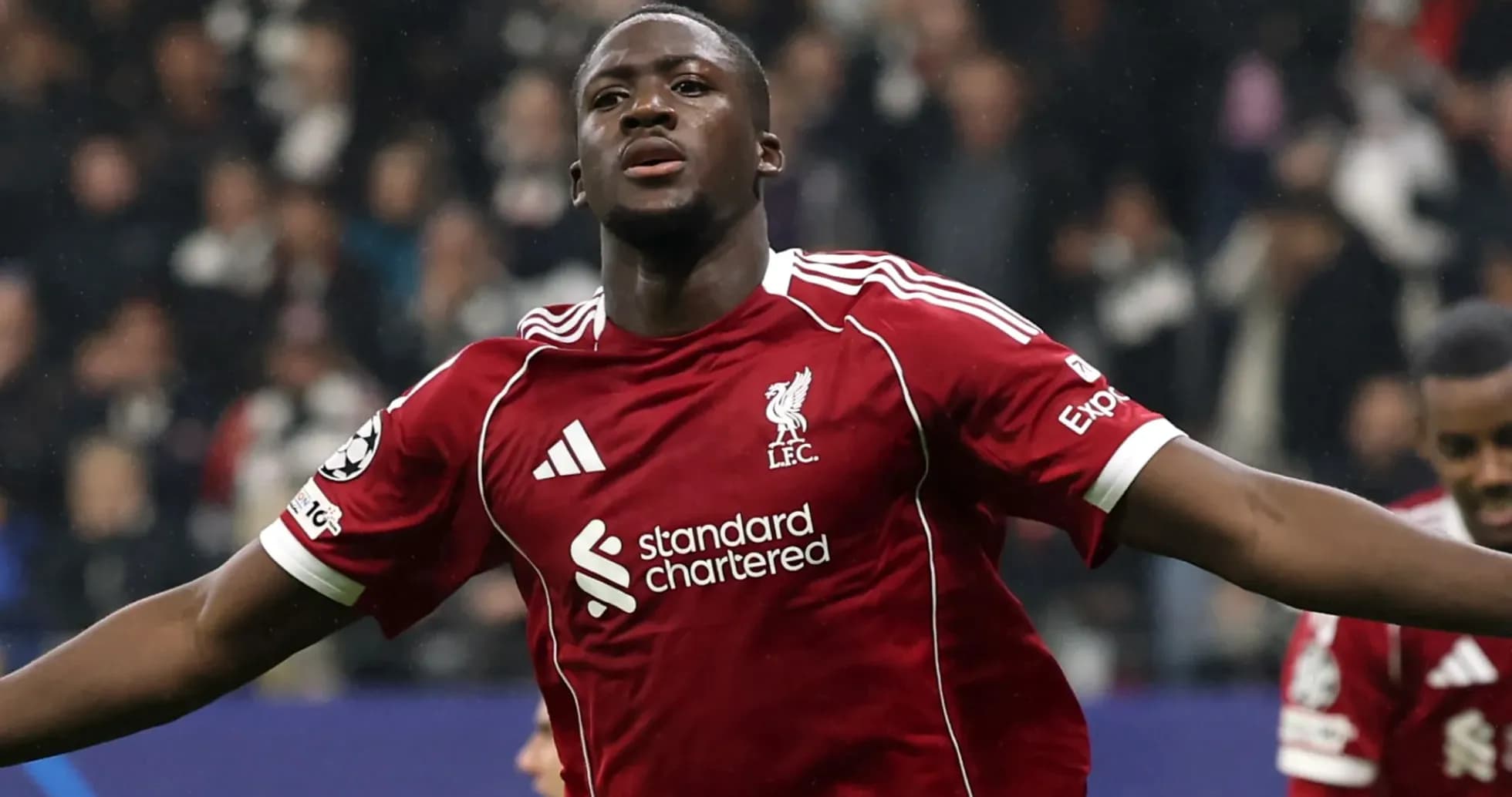 Player celebrating a goal in Liverpool jersey