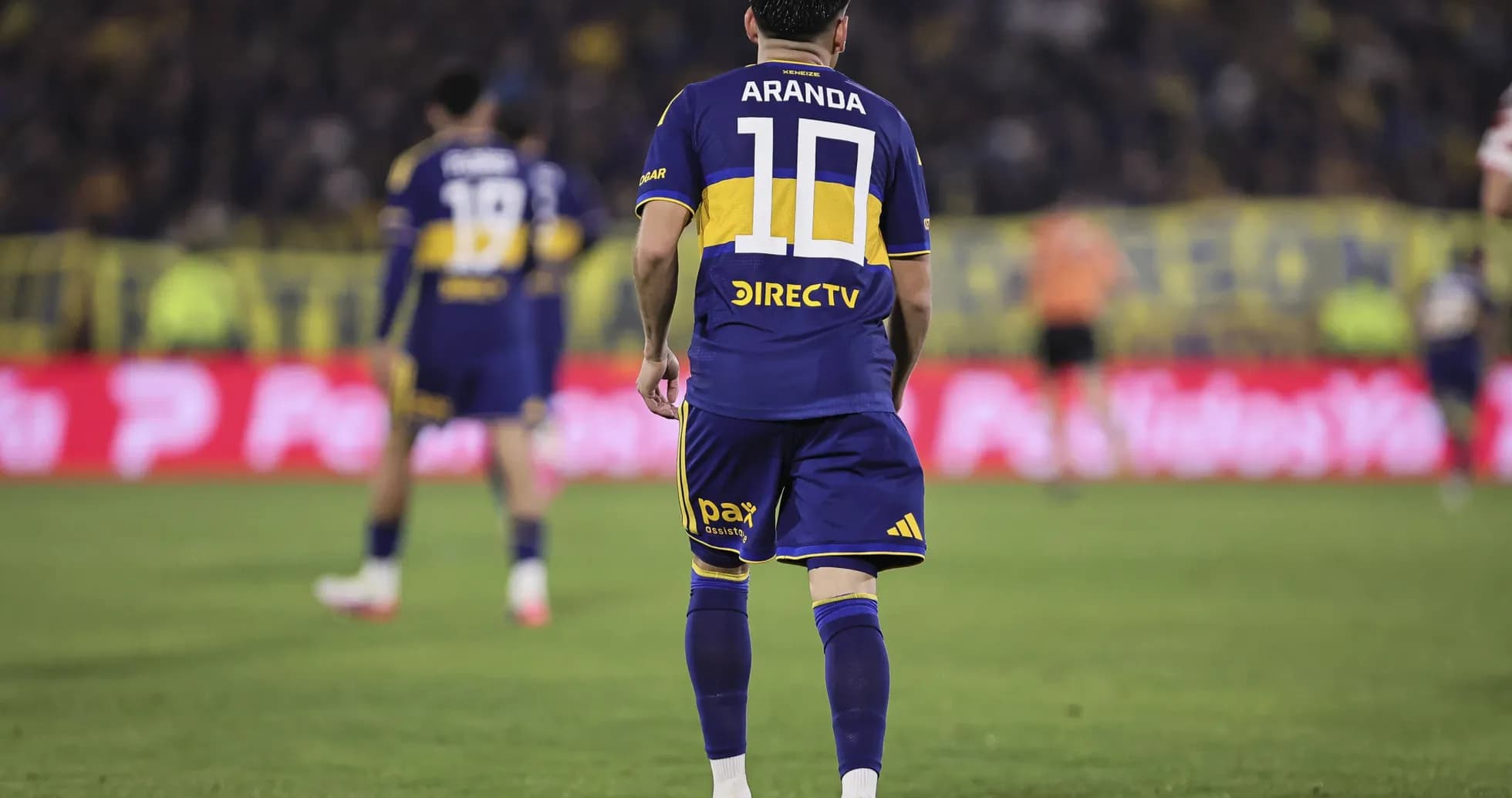 Player in blue and yellow jersey during match