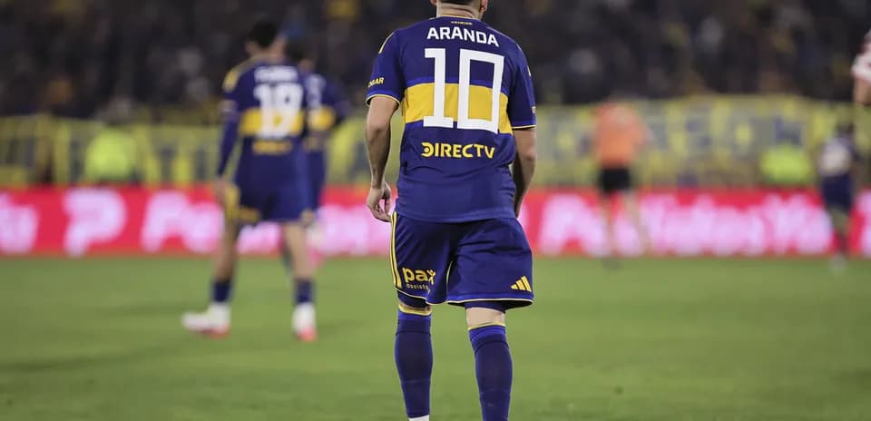 Player in blue and yellow jersey during match