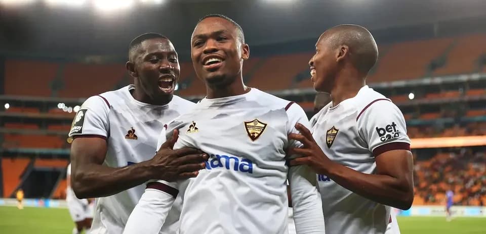 Players celebrating a goal during a match
