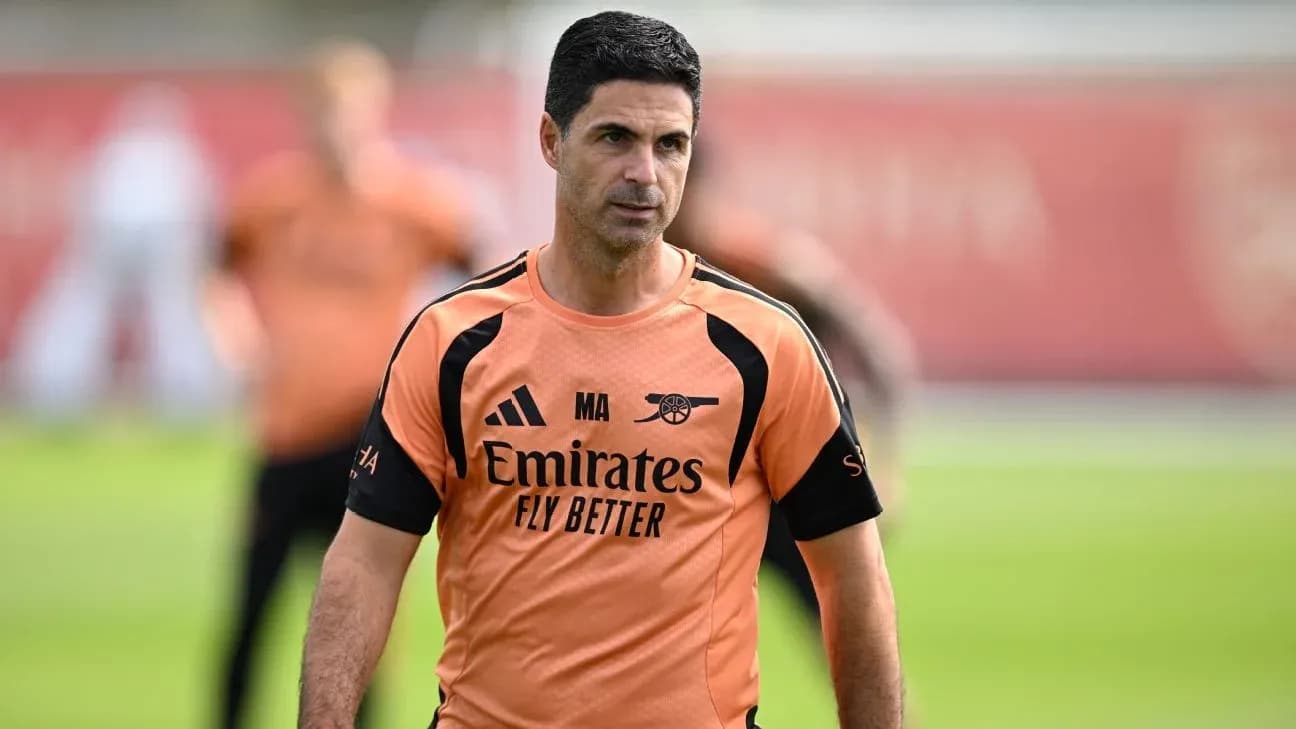 Coach in training session wearing Arsenal kit