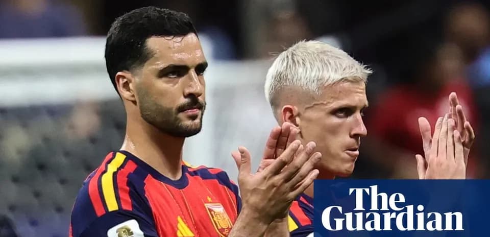 Two Spain players applauding after a match