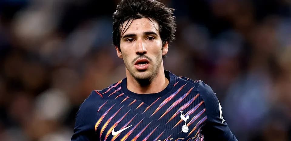 Player wearing Tottenham kit during match action