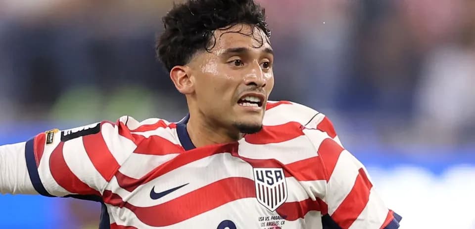 Player in USA jersey during soccer match