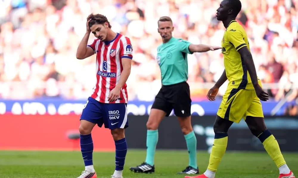 Atletico Madrid player reacts after a foul call