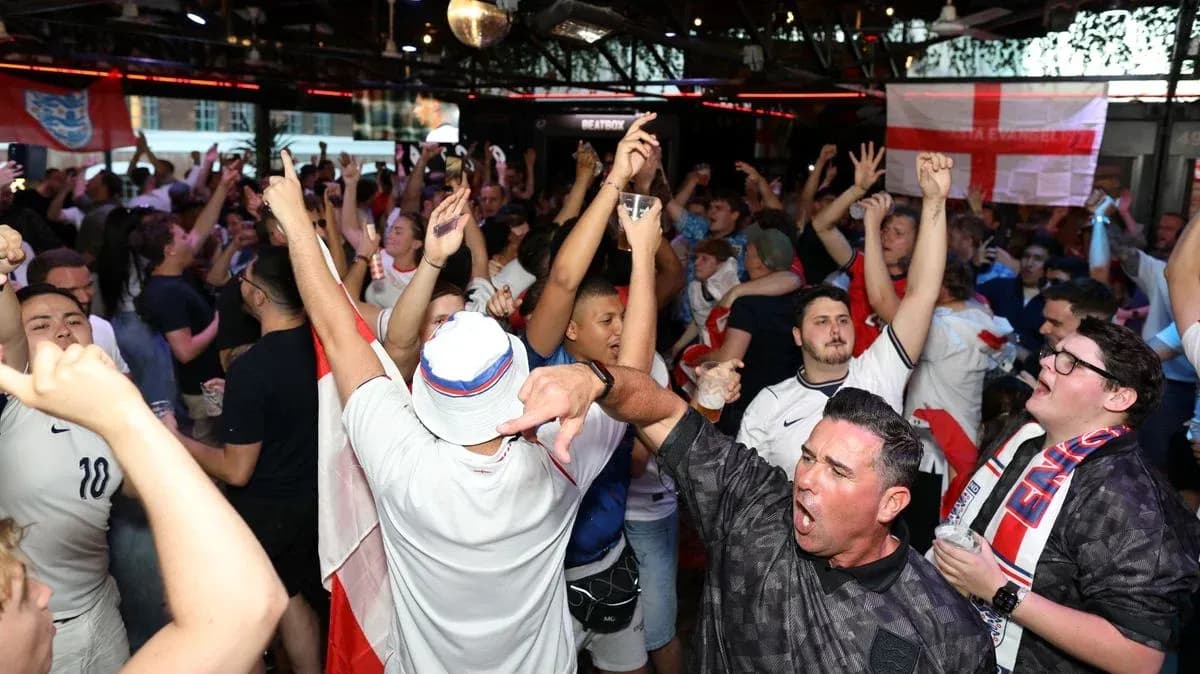 Crowd of fans celebrating in a lively venue