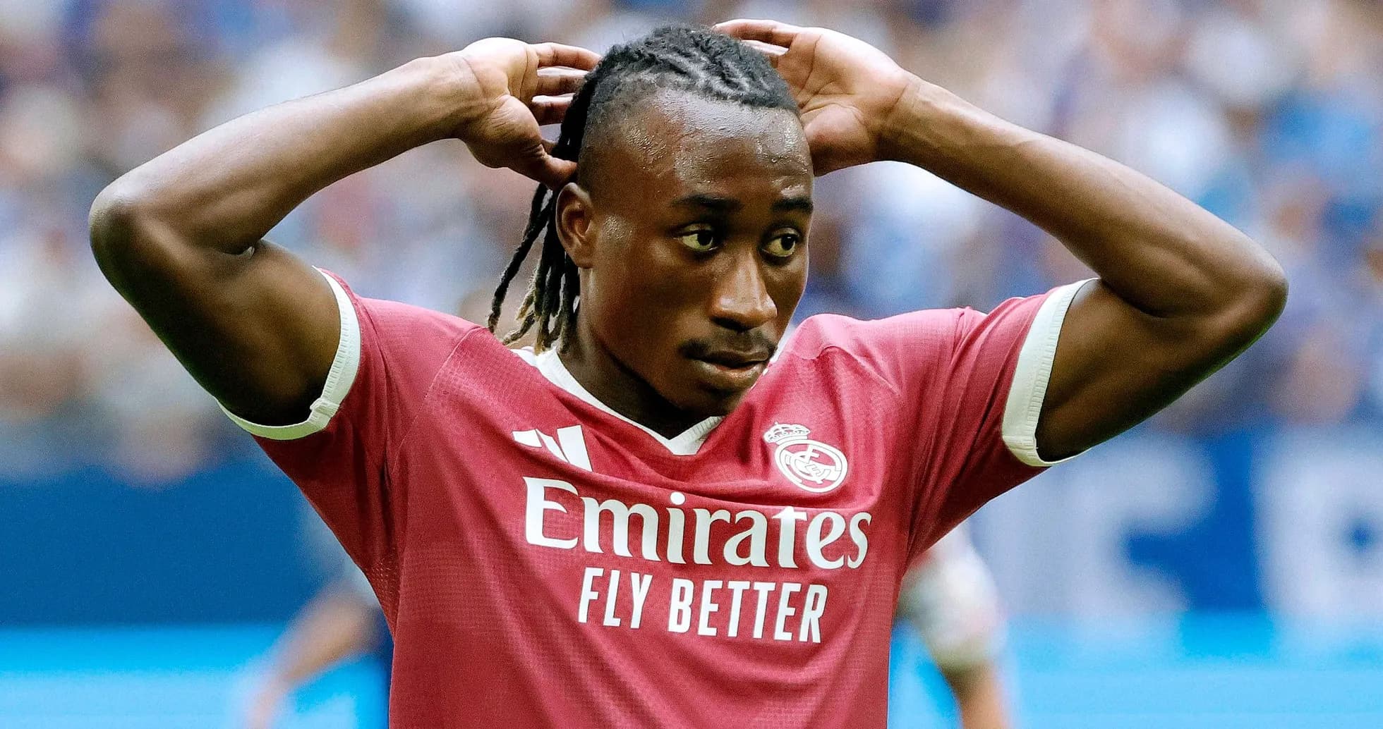 Player in pink jersey adjusting hair during match