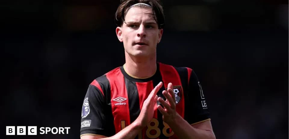 Player applauding fans wearing Bournemouth jersey