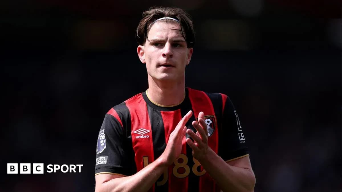Player applauding fans wearing Bournemouth jersey