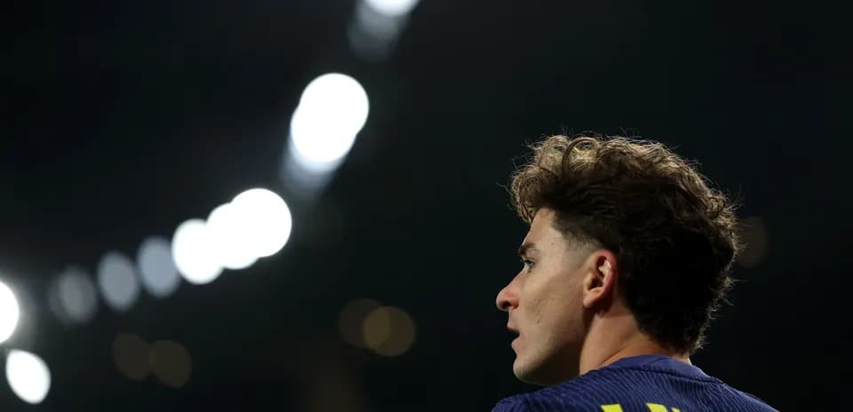 Player J. Alvarez looking away during match