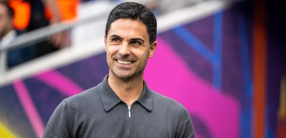 Manager smiling before match in stadium