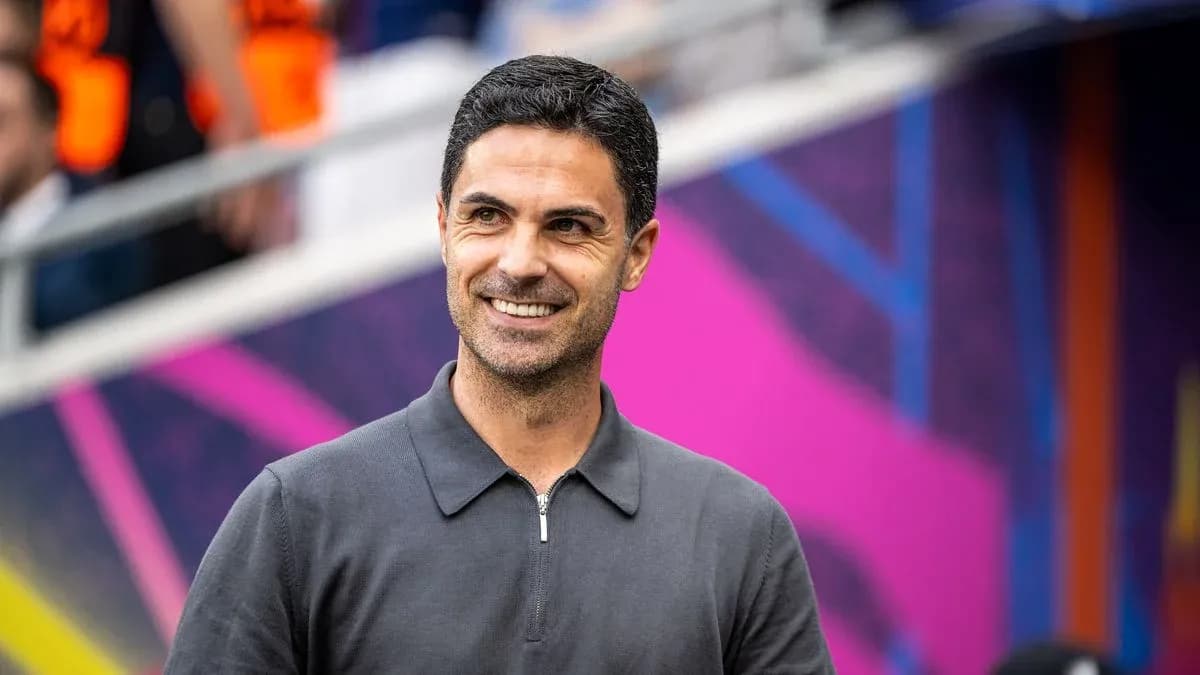 Manager smiling before match in stadium