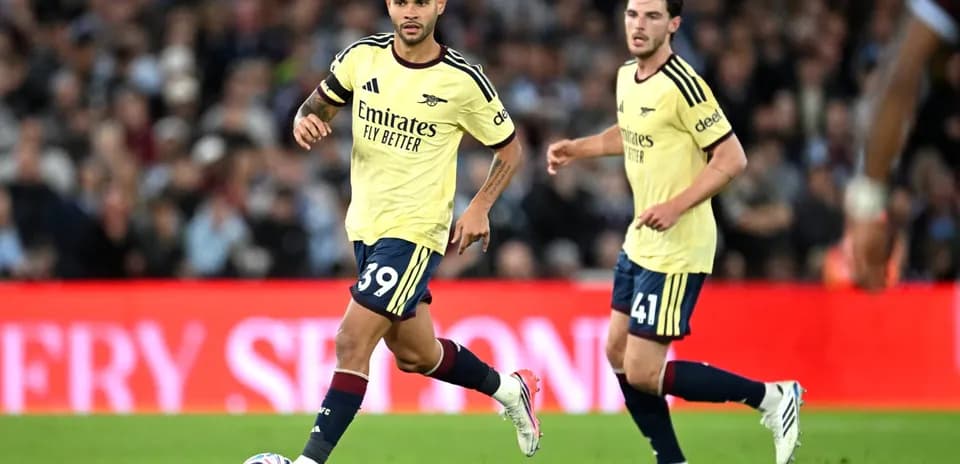 Two Arsenal players during match action on pitch