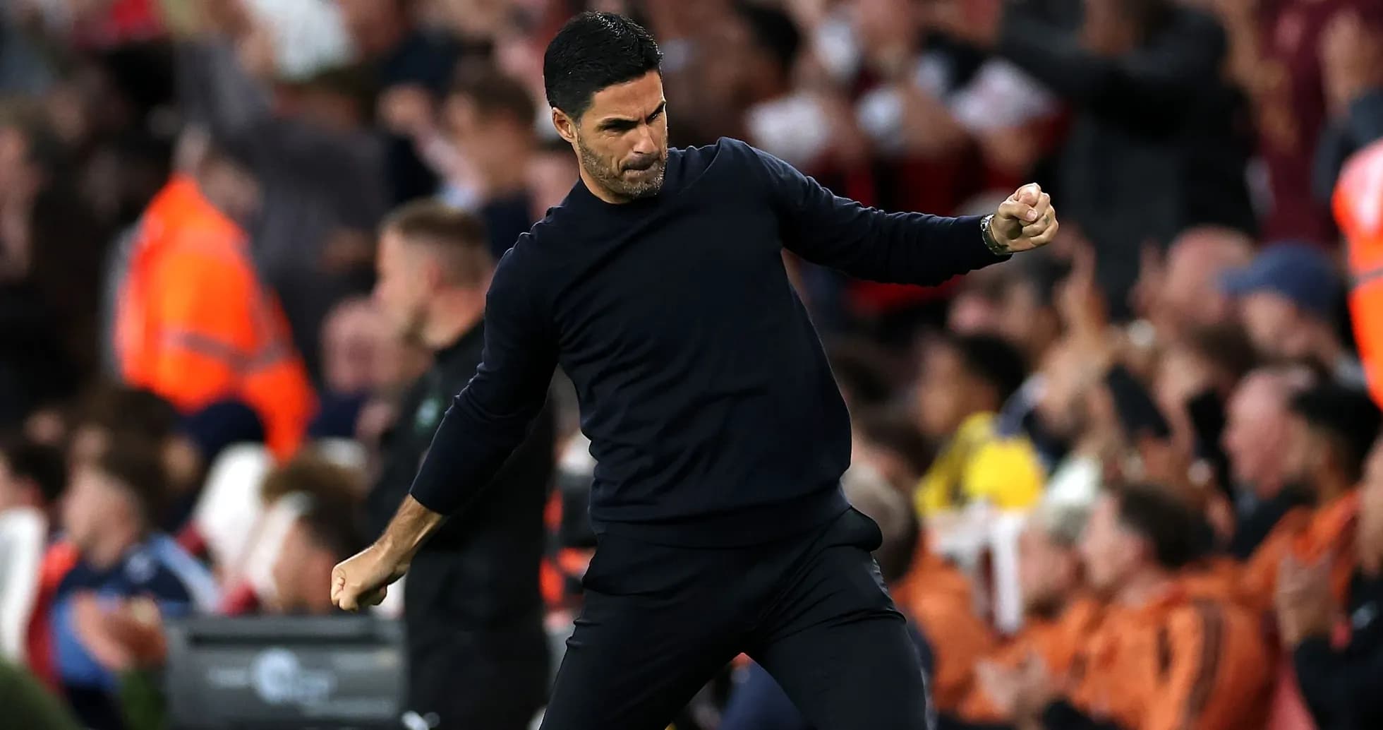 Manager celebrating a goal during the match