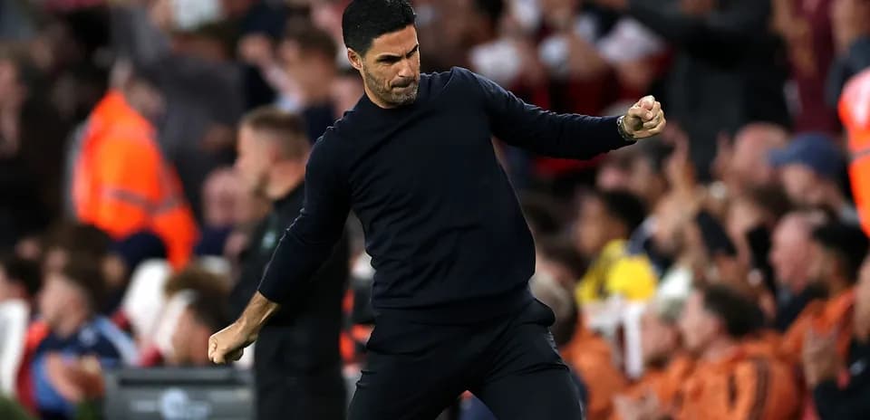 Manager celebrating a goal during the match