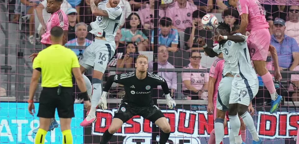 Players contesting a header during match action