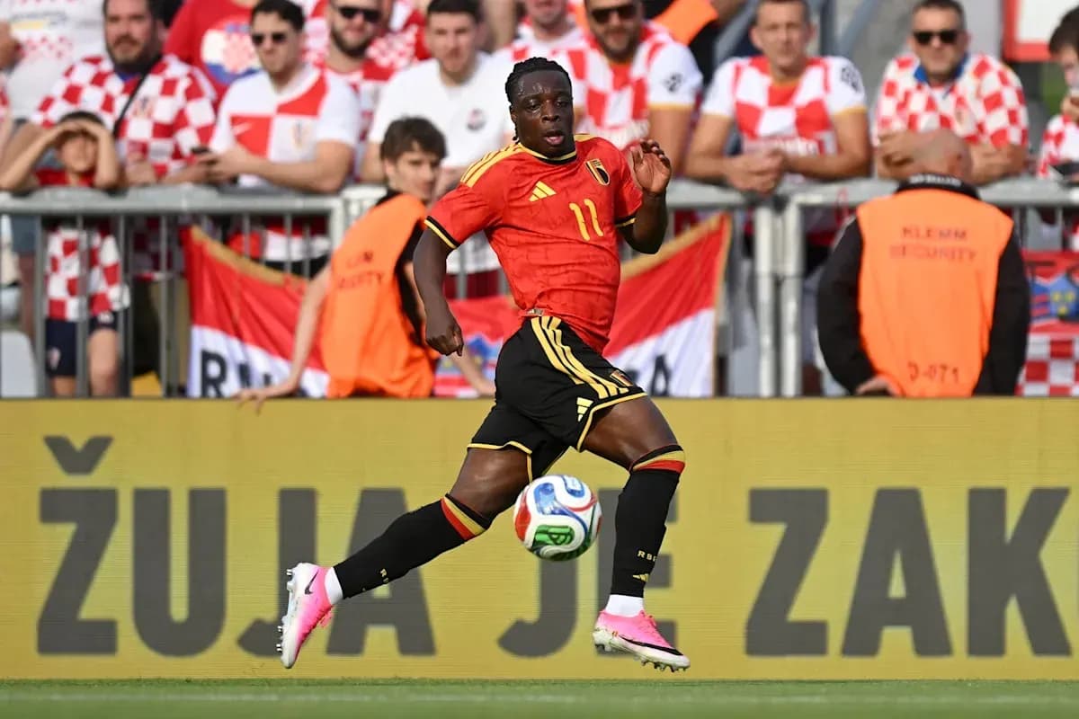 Belgian player sprinting on the field during match