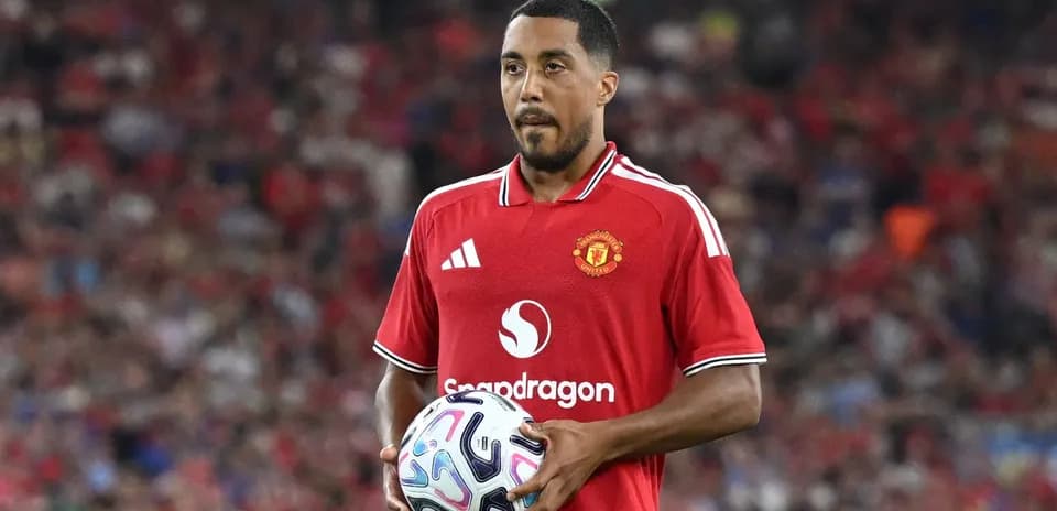 Player holding the ball during match at stadium