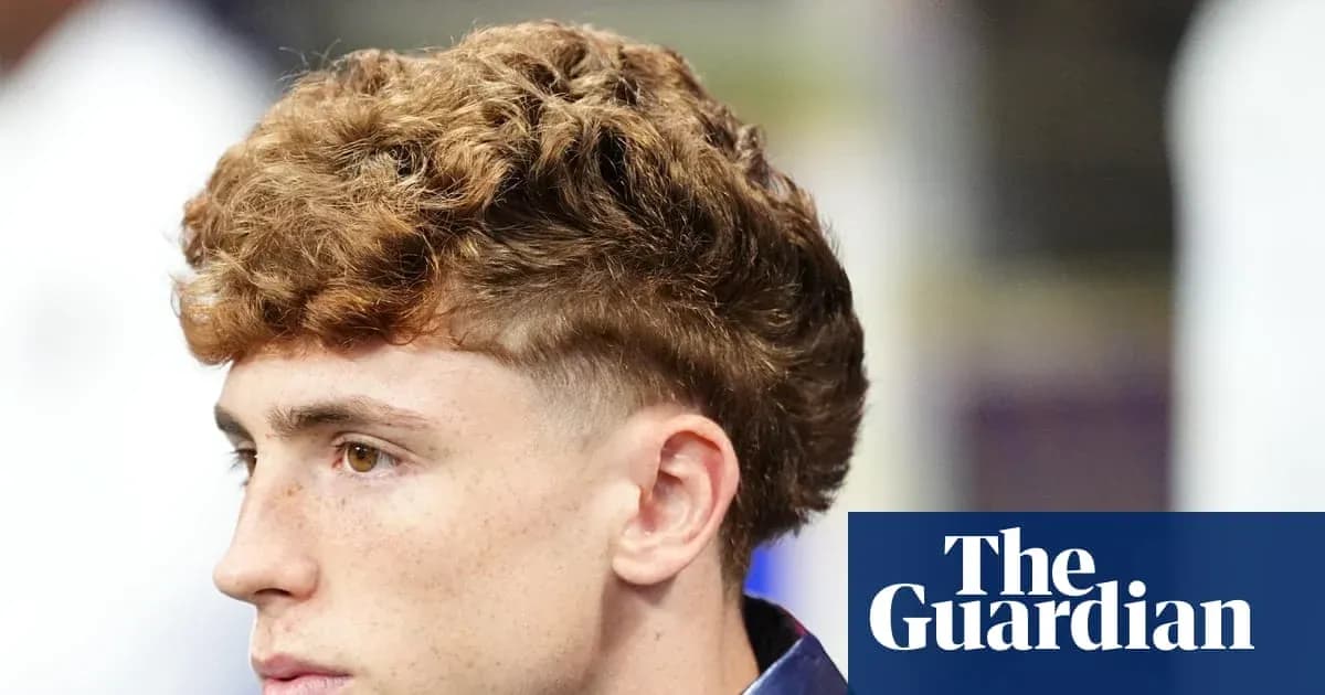 Young man with curly hair looking to the side