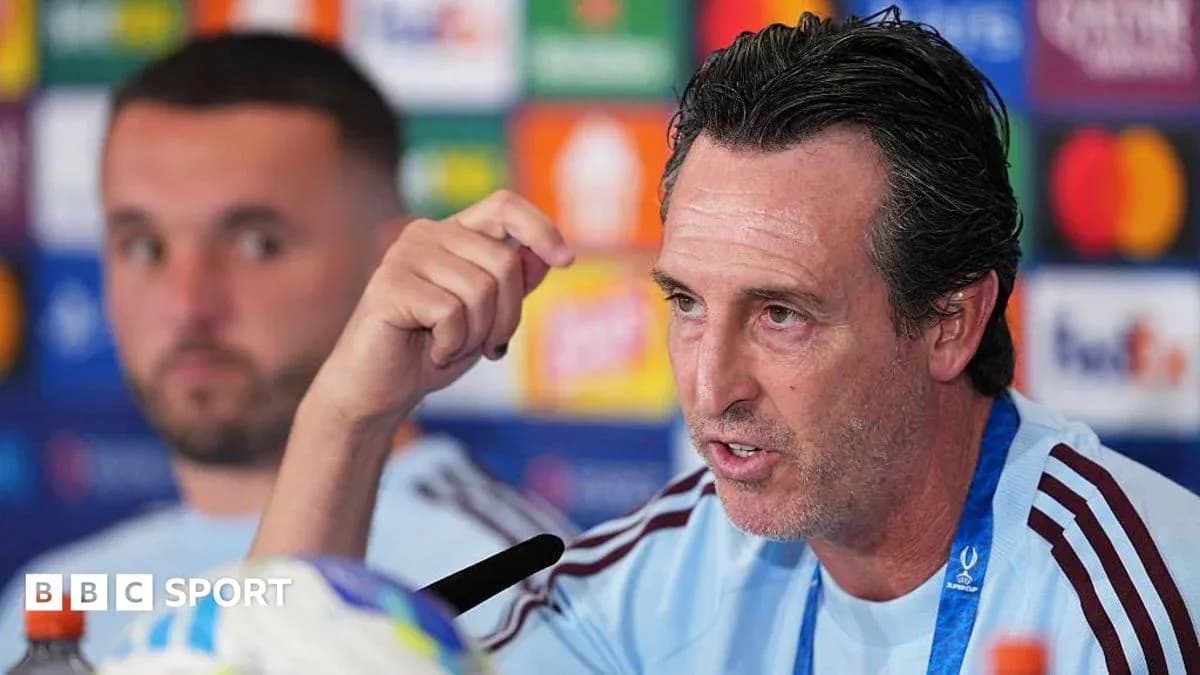 Manager speaking at press conference with player behind