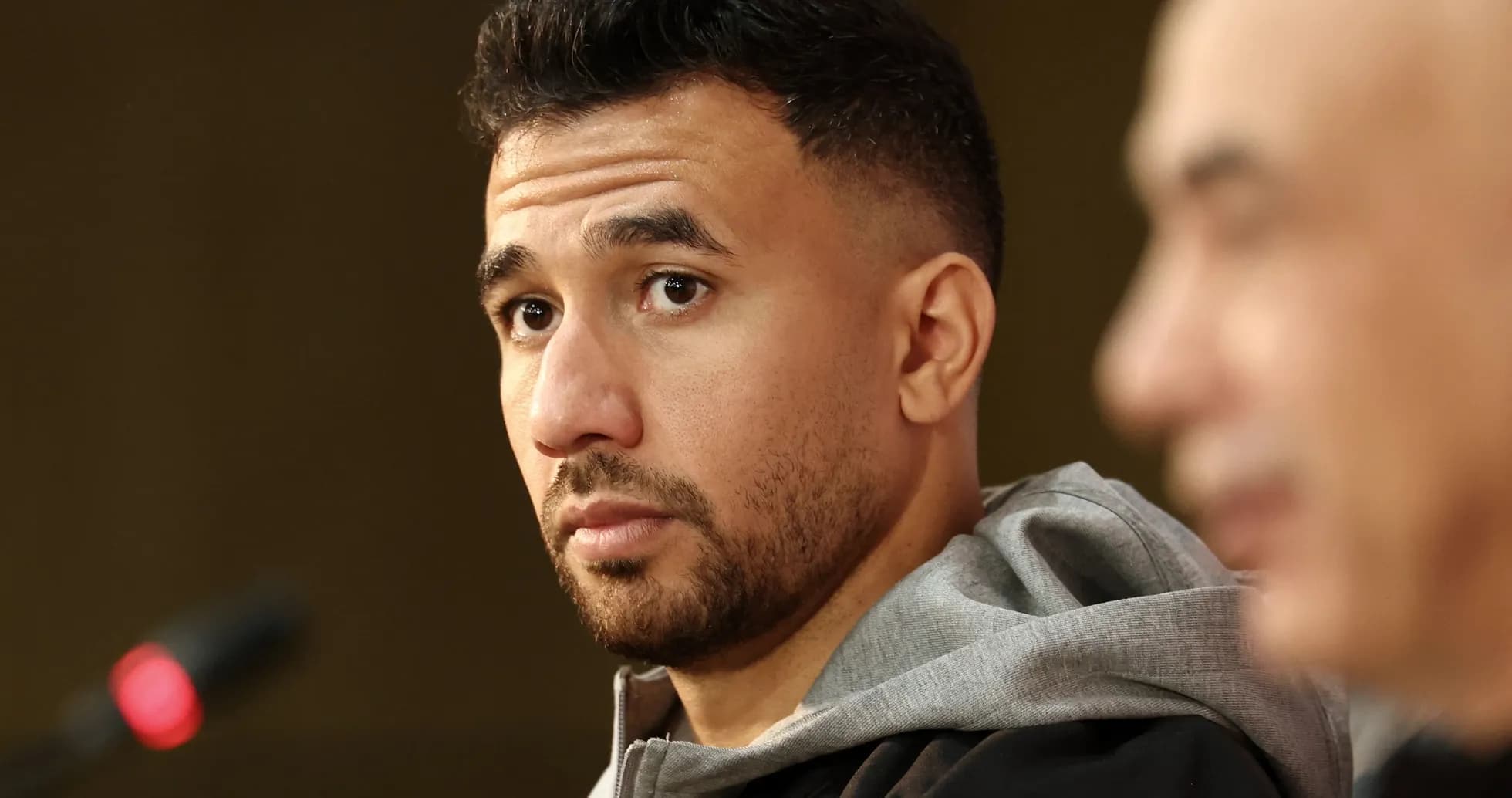 Player at press conference with microphone visible