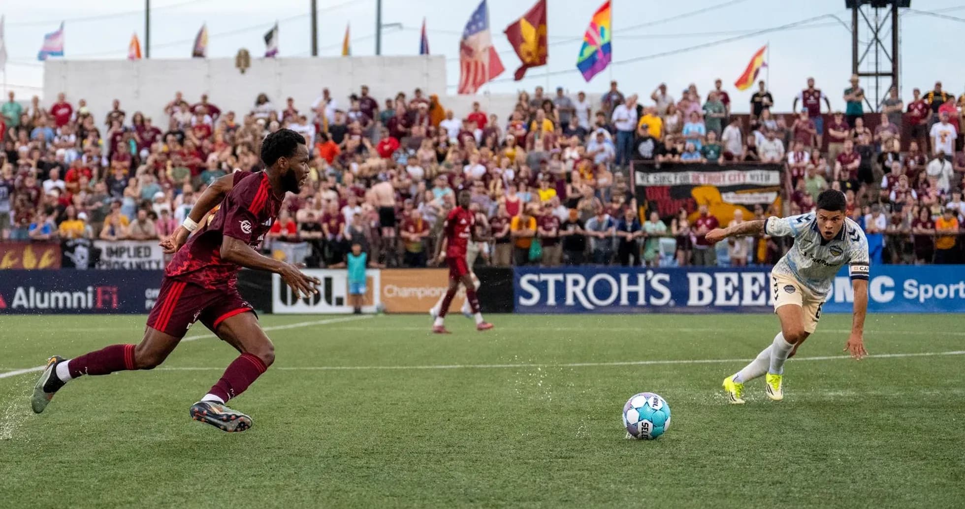 Players competing for the ball in USL match