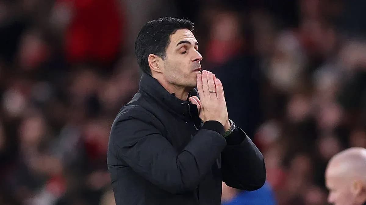 Coach with hands clasped during a match