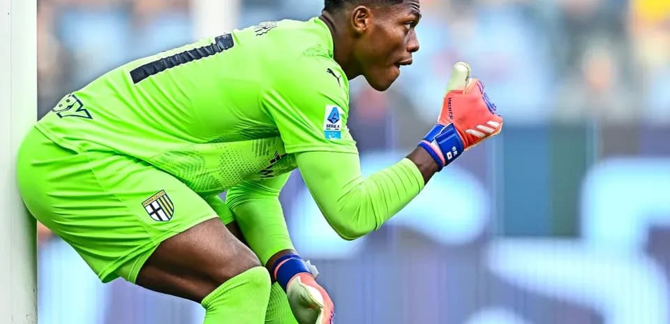 Goalkeeper gesturing during a match in green kit