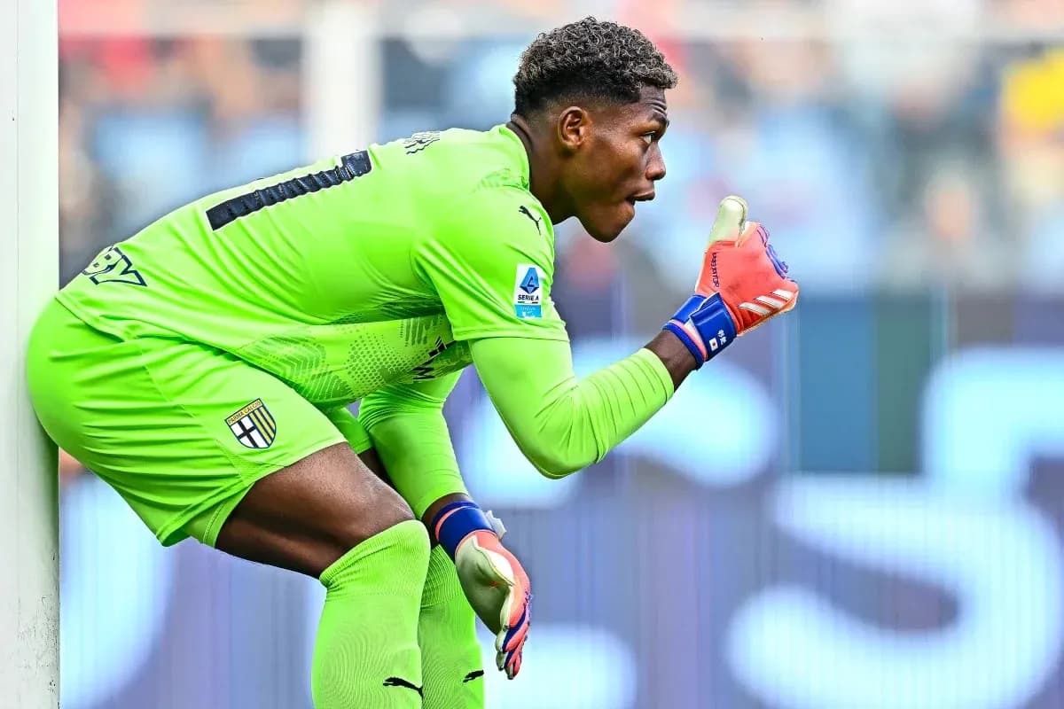 Goalkeeper gesturing during a match in green kit