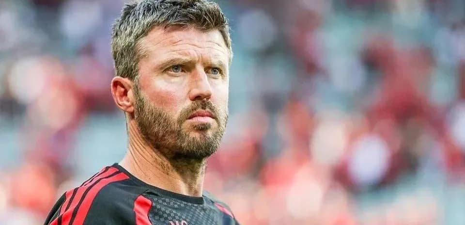 Man in sportswear looking focused on field