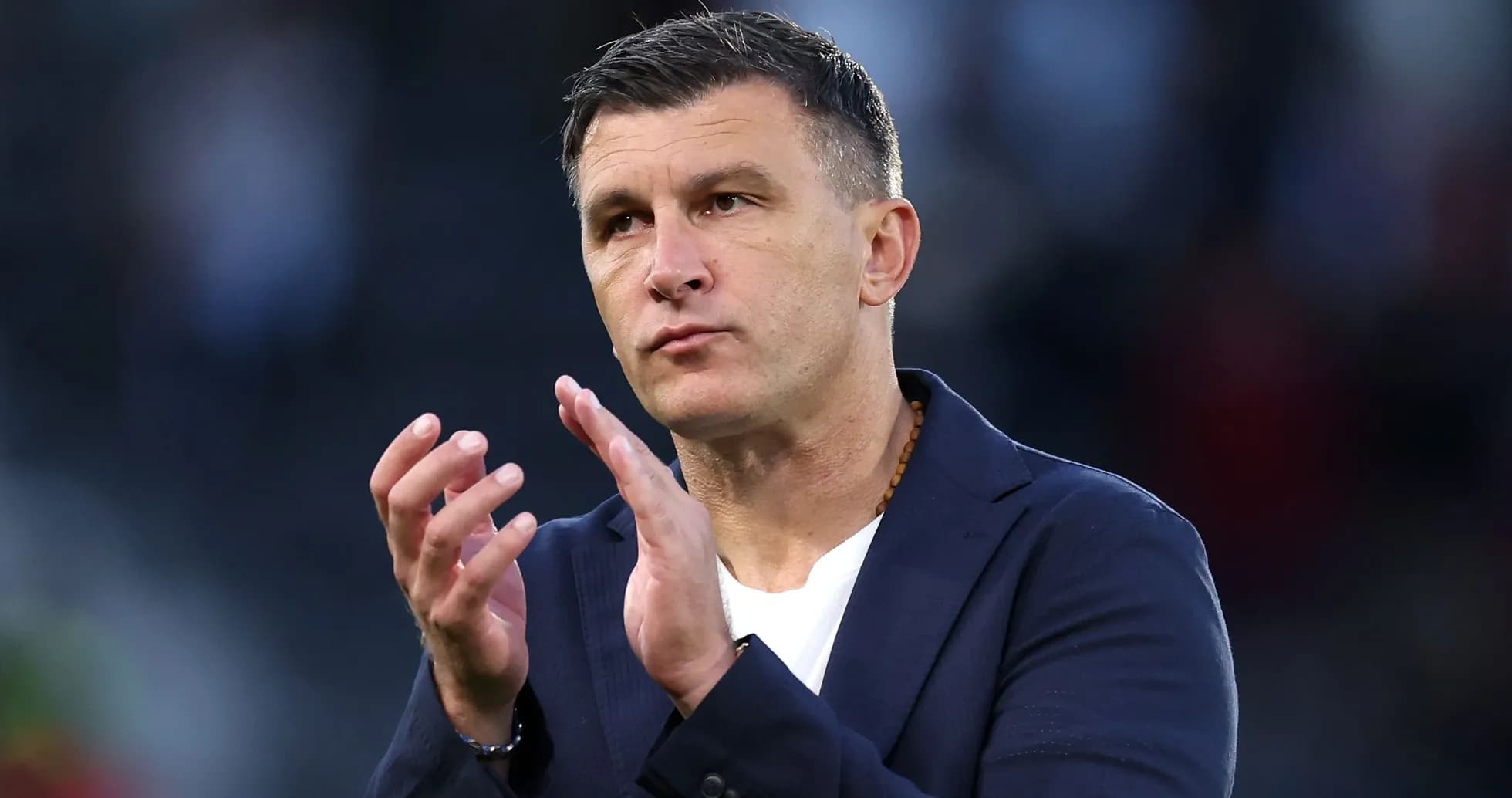 Coach gesturing during match celebration or discussion