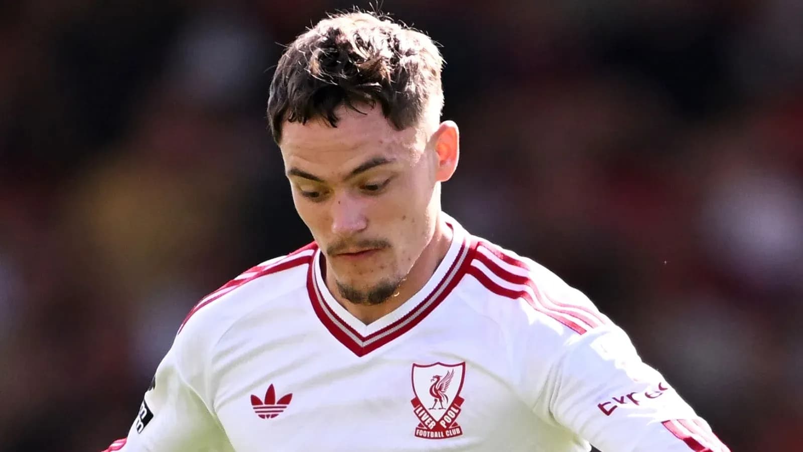 Player wearing Liverpool jersey during match action