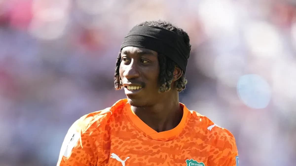 Goalkeeper in orange jersey during a match