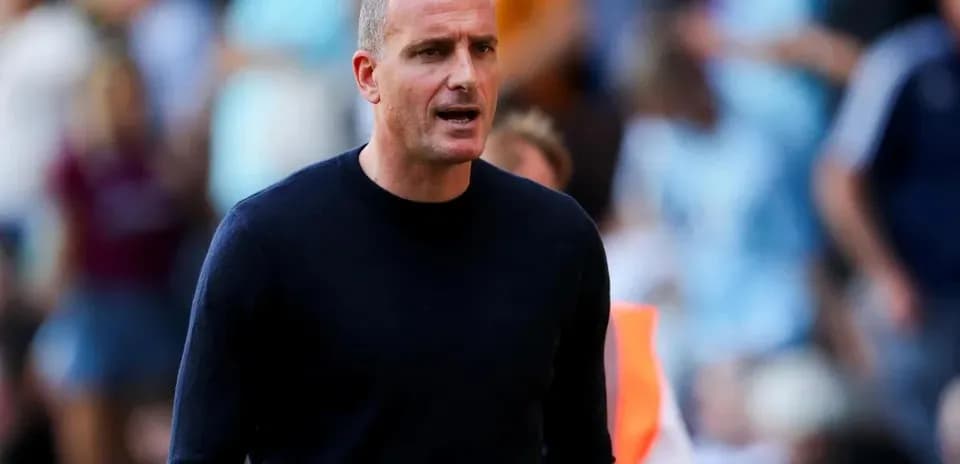 Coach on the sidelines during a match