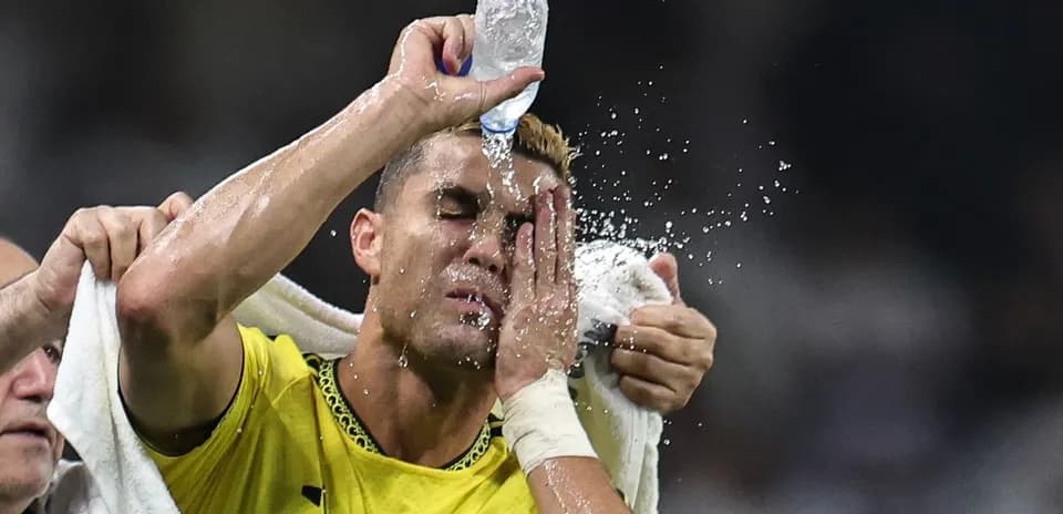 Player cooling off with water during match