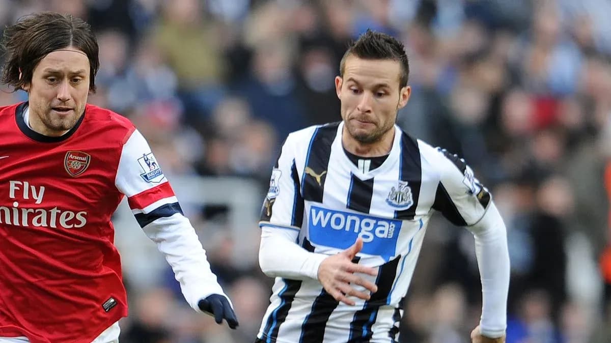 Players from Arsenal and Newcastle competing for the ball Players from Arsenal and Newcastle competing for the ball