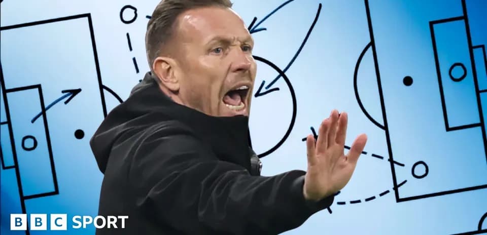 Coach gesturing during tactical discussion on field