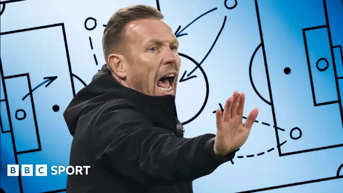 Coach gesturing during tactical discussion on field